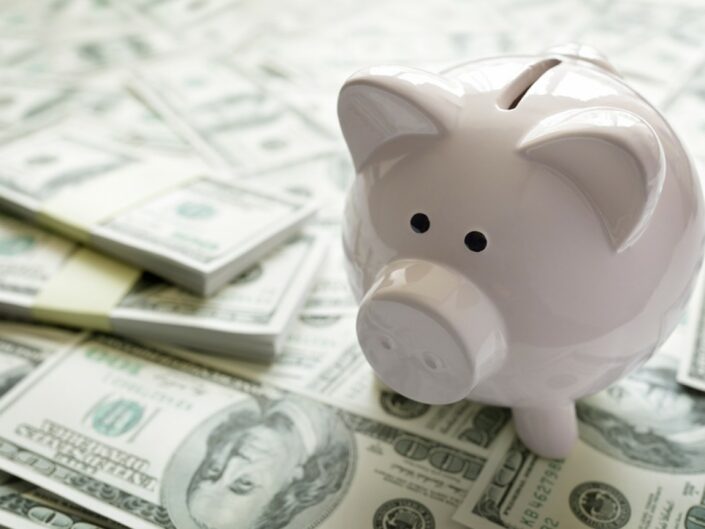 Piggy-bank-on-money-concept-fo-118171091-705x529