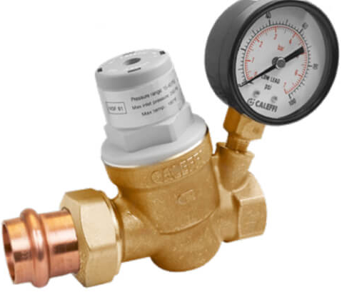 A closeup picture of a valve with a meter fixed on it